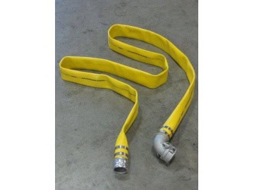 Yellow fire hose on concrete floor