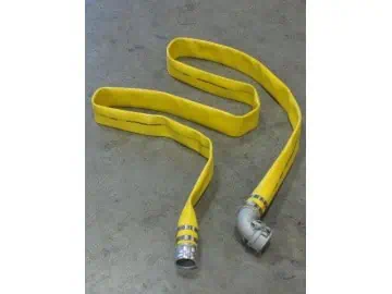 Yellow fire hose on concrete floor