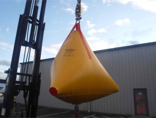 Yellow lifting test water bag with forklift.