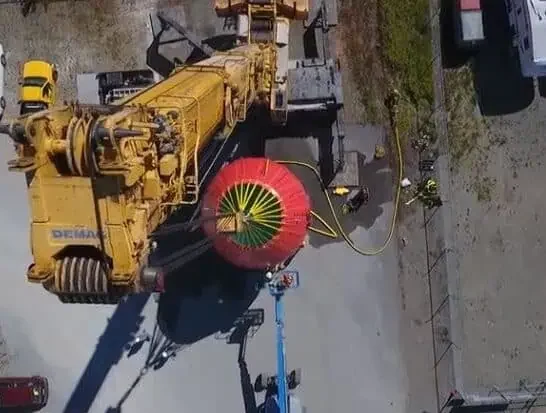 Aerial view of large crane lifting crane test water bags