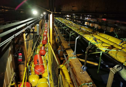 Warehouse filled with yellow and red cylinders.