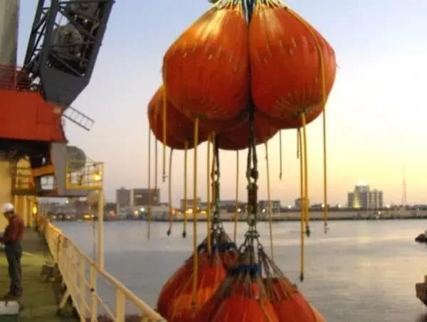 Offshore crane lifting orange load test water bags