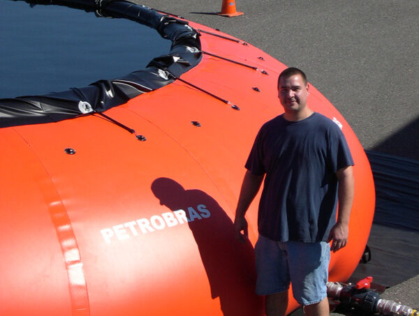 Person beside large Petrobras inflatable tank