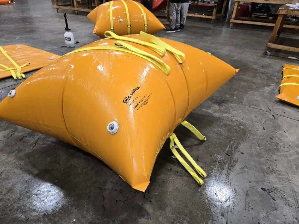 Orange industrial air bladder on workshop floor