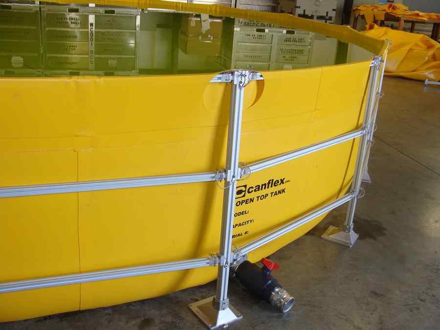 Yellow open top water storage tank indoors