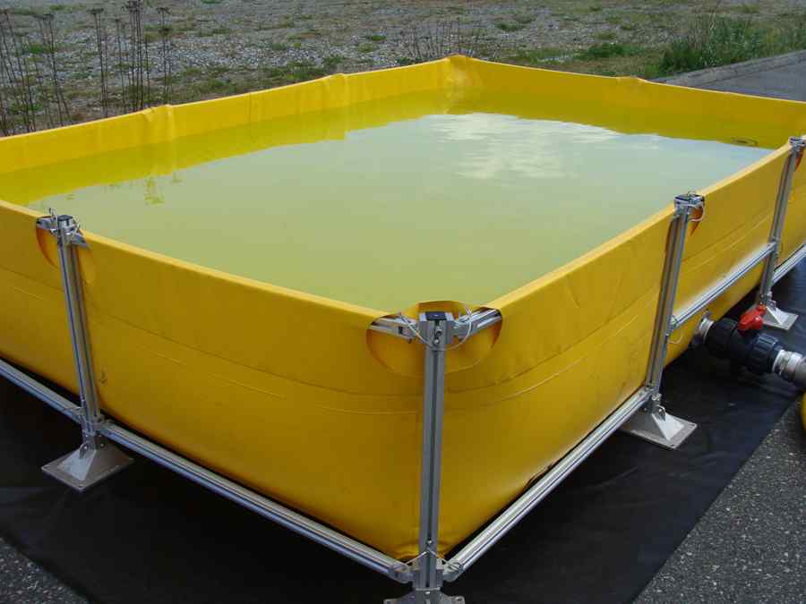 Large yellow portable water storage tank outdoors