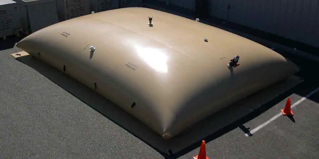 Large beige flexible water storage tank outdoors