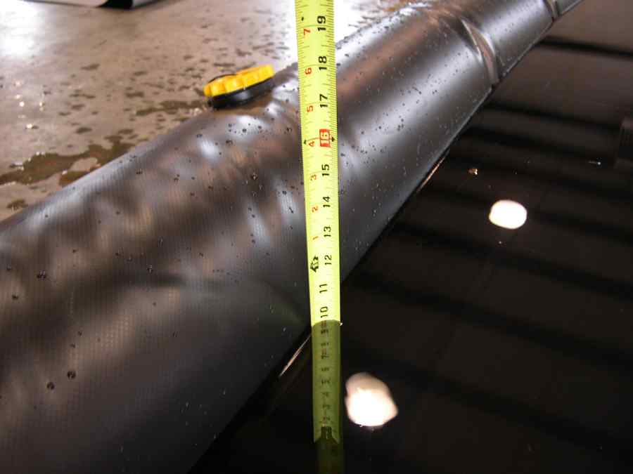 Measuring tape on wet black material surface