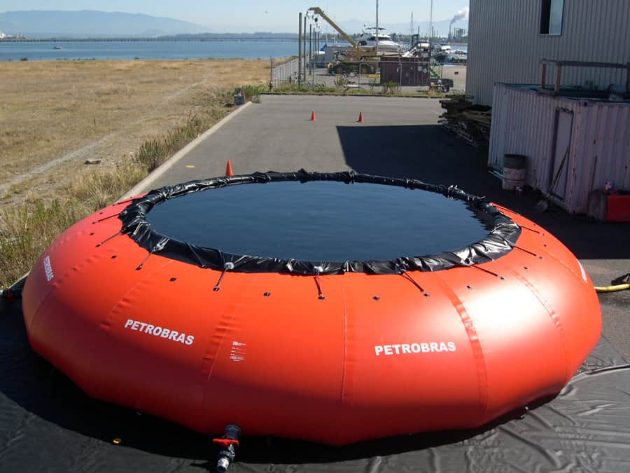 Red inflatable liquid storage tank outdoors