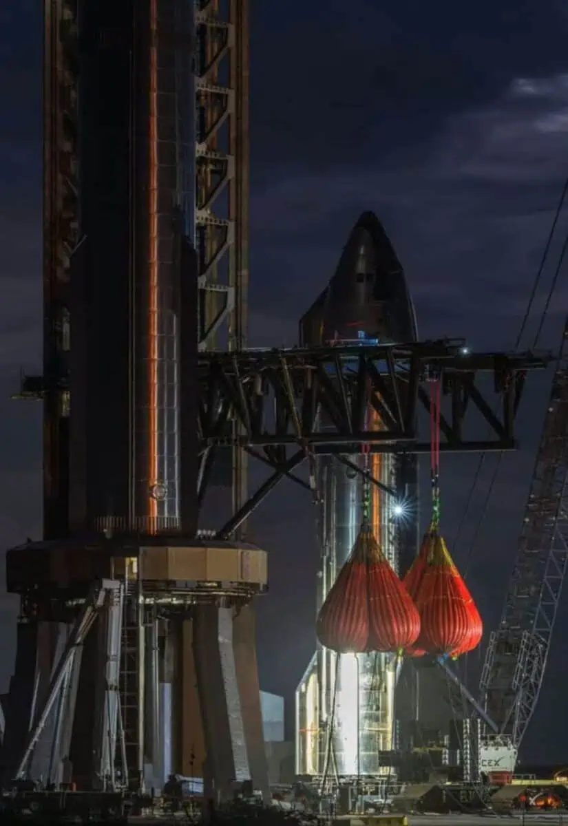 Rocket and launch tower at night construction site