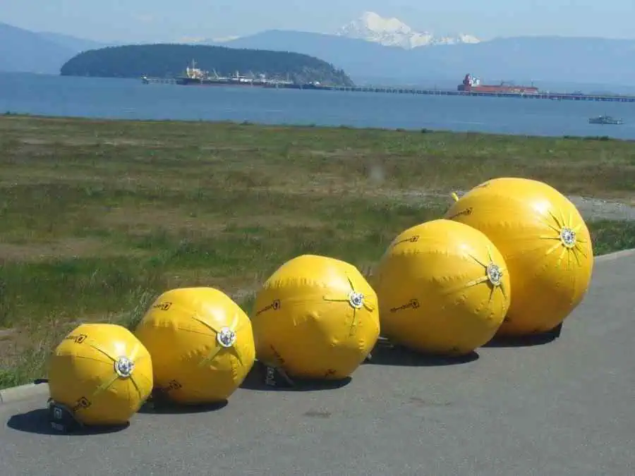 Large yellow inflatable buoys near the sea