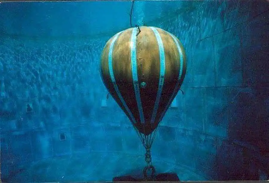 Underwater balloon anchored to the pool floor