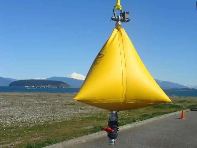 Yellow inflatable water tank near the ocean