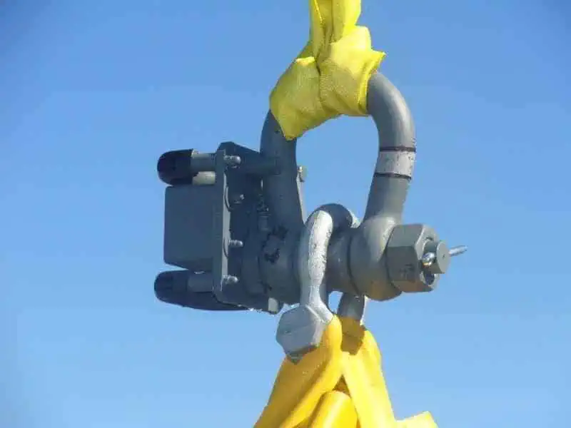 Industrial shackle with yellow lifting strap
