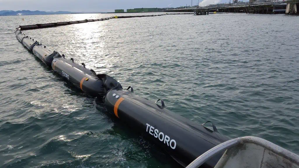 Oil containment boom floating on ocean water