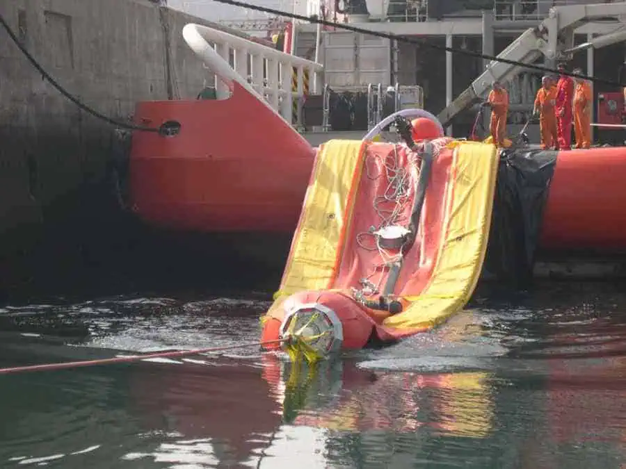 Workers testing marine rescue capsule in water