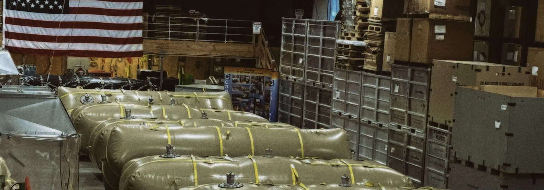 Industrial storage tanks in warehouse with American flag